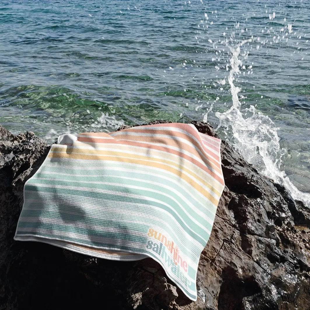 sand-free waffle towel with a mermaid-inspired gradient, quick-dry & lightweight with a matching bag.