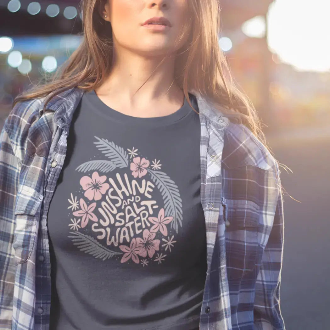 Woman wearing a graphic t-shirt standing on the boardwalk